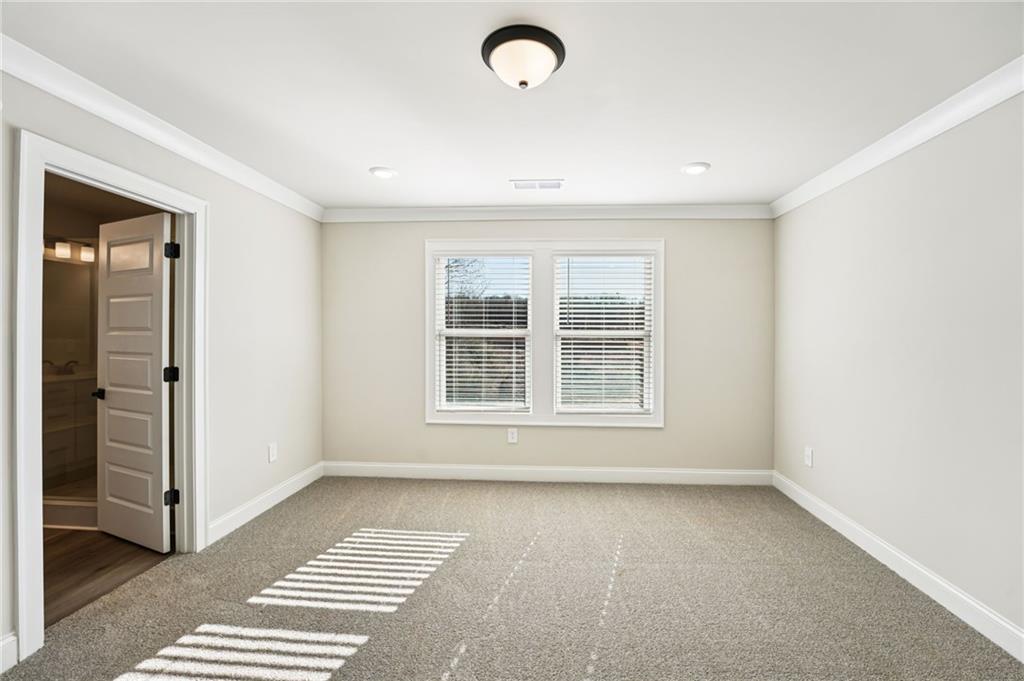 6450 Pinin Place Cumming, GA 30041 - Photo 42 of 53 a view of an empty room with a window