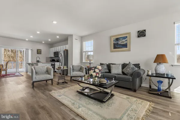 a living room with furniture or couch and a wooden floor