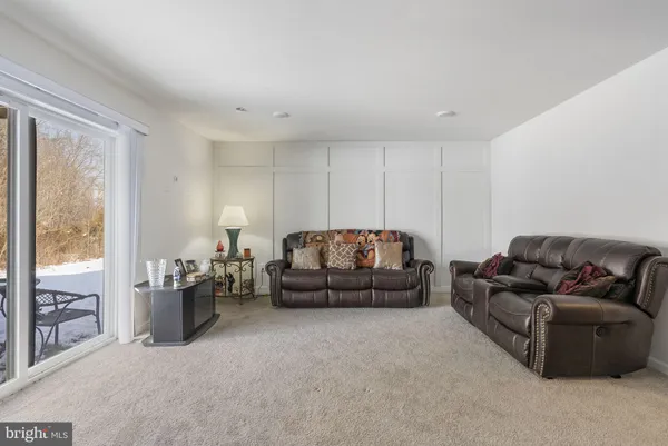a living room with furniture and a couch