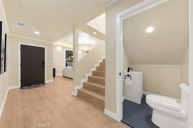 a spacious bathroom with a toilet and a shower