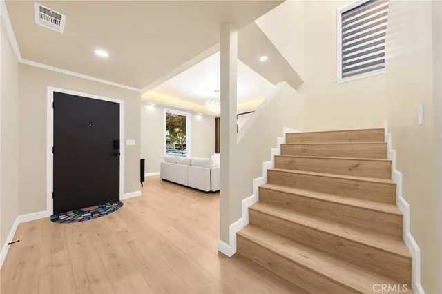a view of staircase with white walls and windows