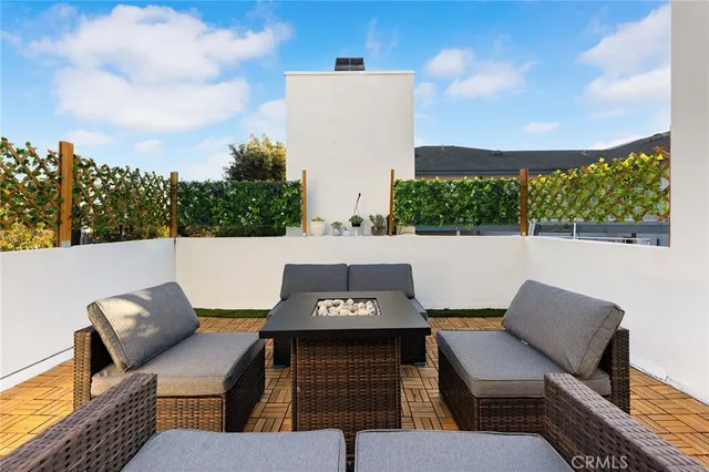 a view of a terrace with furniture