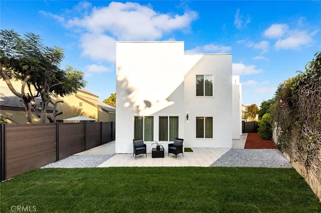 a view of house with yard and entertaining space