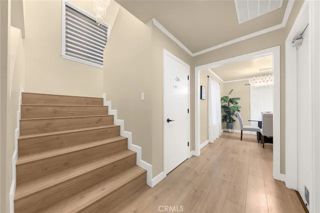 a view of a hallway to a bedroom and wooden floor