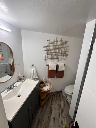 a bathroom with a sink a toilet and tub