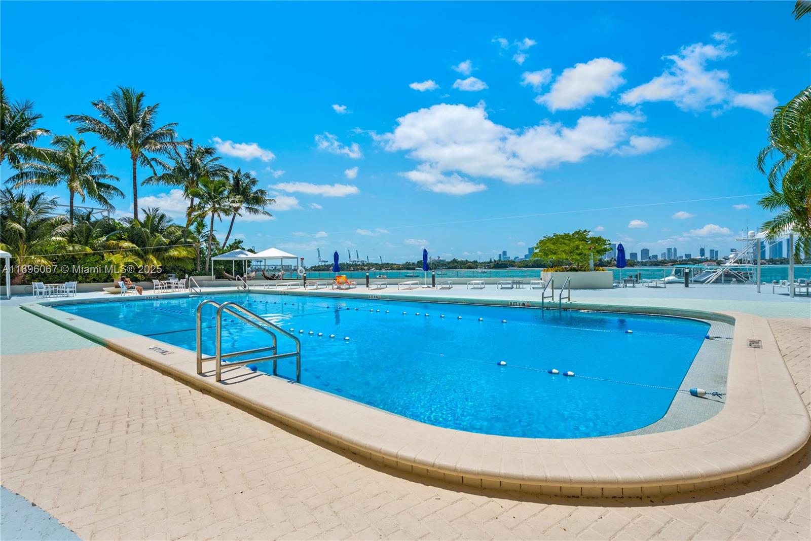 1200 West Avenue, Unit 914 Miami Beach, FL 33139 - Photo 30 of 38 a view of a swimming pool with a yard