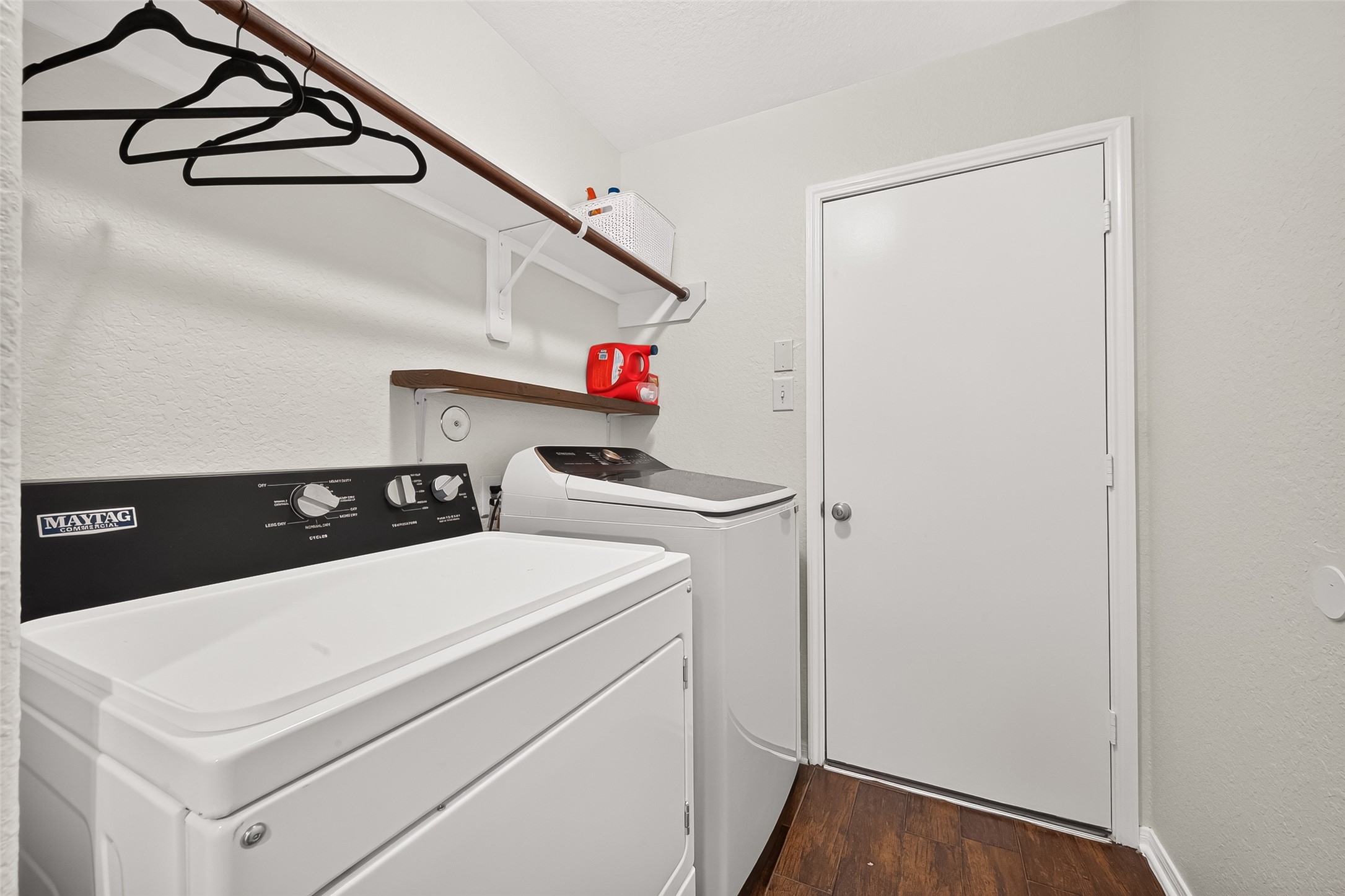 3155 View Valley Trail Katy, TX 77493 - Photo 43 of 50 Convenient dedicated laundry room with overhead storage shelf and durable flooring.