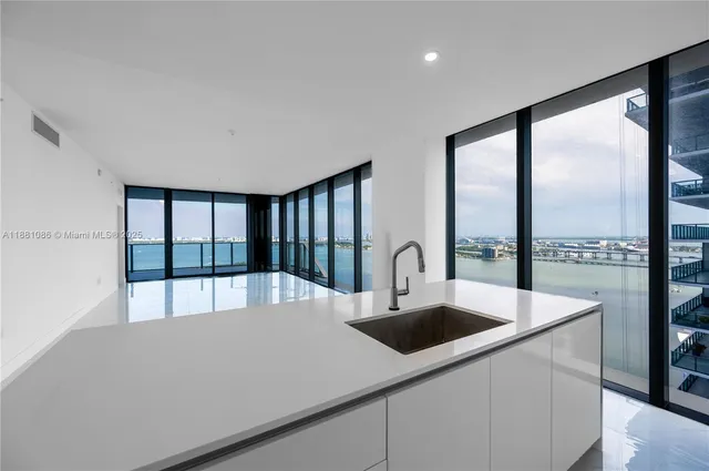 a view of a kitchen from a living room