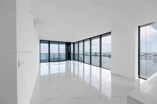 a view of an empty room and window