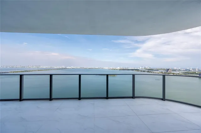 a view of balcony with ocean and ocean view
