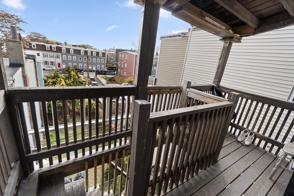 225 London Street Boston, MA 02128 - Photo 7 of 10 a view of balcony with wooden floor