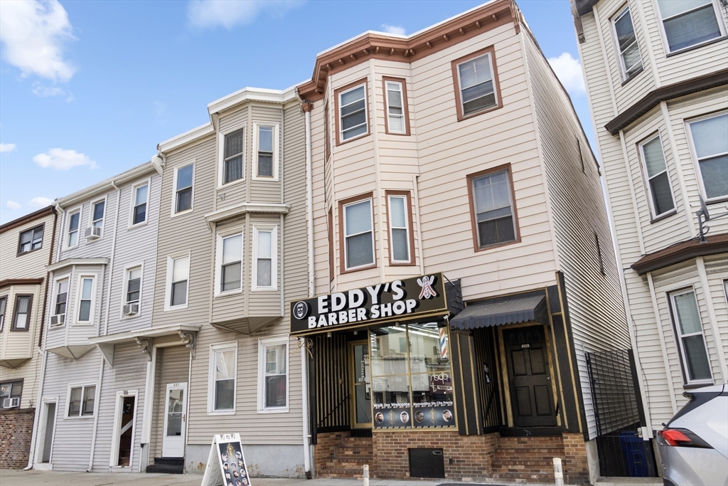225 London Street Boston, MA 02128 - Photo 8 of 10 a front view of a multi story building