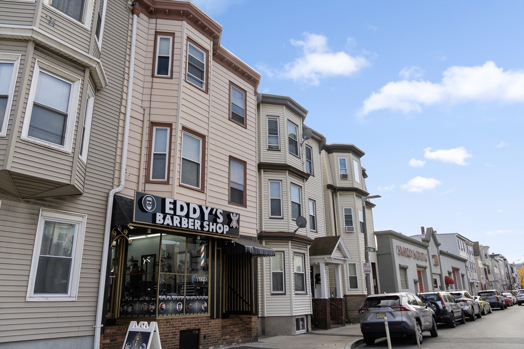 225 London Street Boston, MA 02128 - Photo 9 of 10 a front view of a multi story building