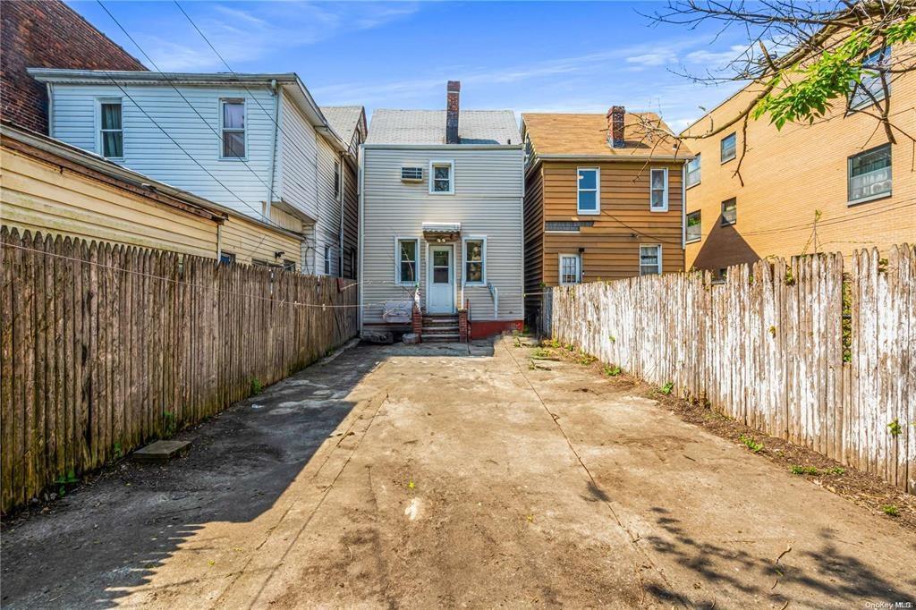 150-12 107th Avenue Queens, NY 11433 - Photo 16 of 16 a view of a house with wooden fence