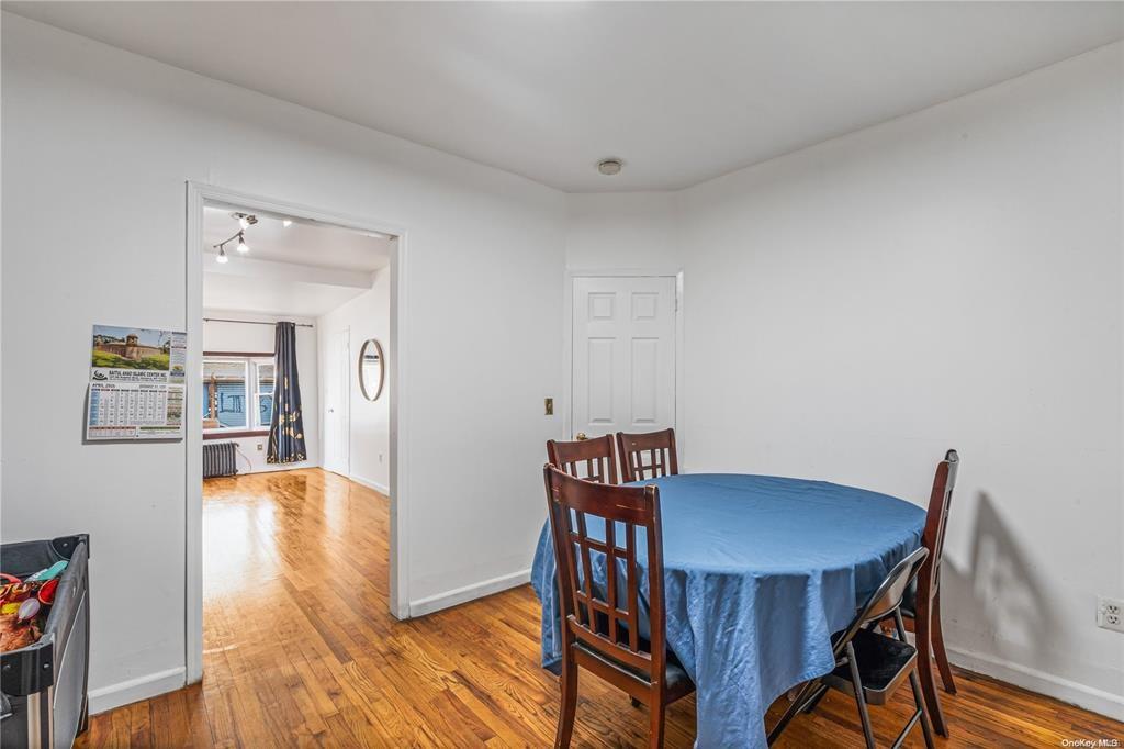 150-12 107th Avenue Queens, NY 11433 - Photo 5 of 16 a view of a dining room with furniture and wooden floor