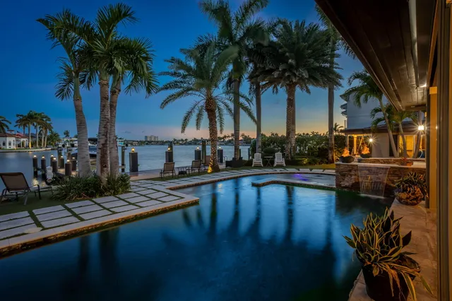 a view of swimming pool with chairs