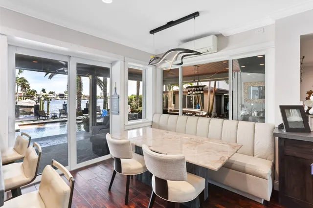 a spacious bedroom with a bed couch and a window
