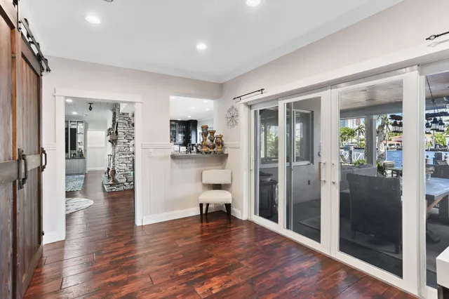 a bathroom with a granite countertop sink a toilet a mirror and shower