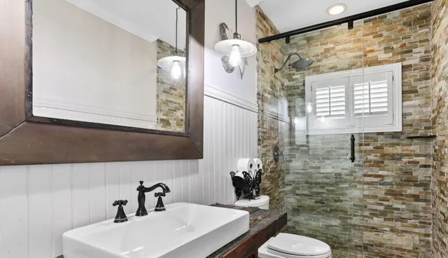 a living room with furniture and floor to ceiling windows