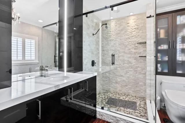 a swimming pool view with a seating space