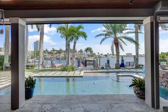 a view of multiple house with a yard and sitting area