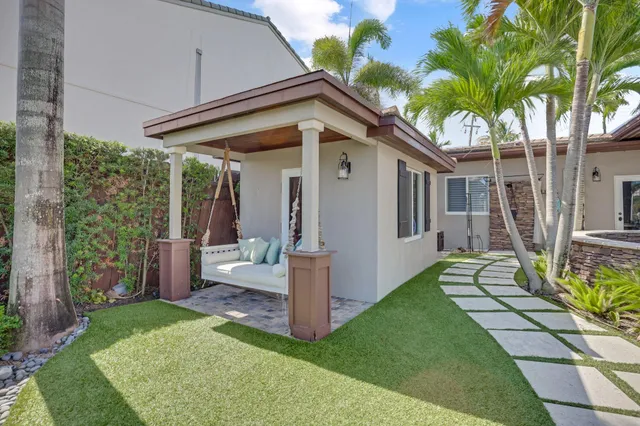 a view of a balcony with lake view and a potted plant