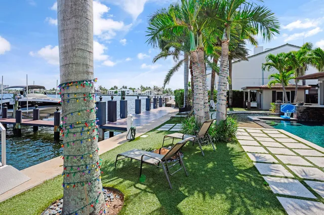 a view of a house with a yard and garage