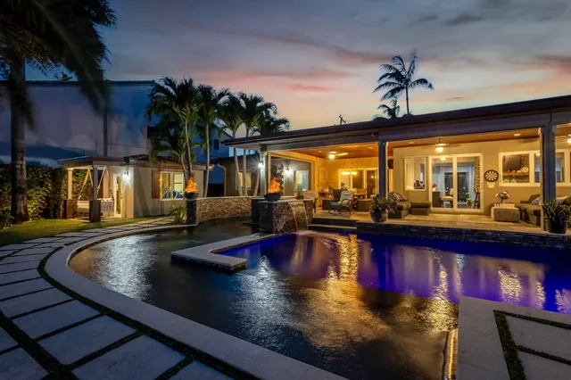 a balcony with chairs and a table