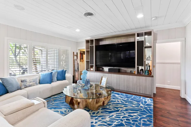 a kitchen with stainless steel appliances kitchen island granite countertop a stove and a sink