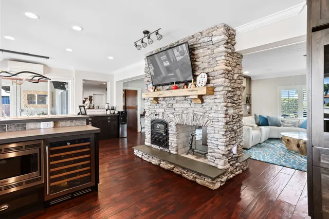 a dining room with furniture and large windows