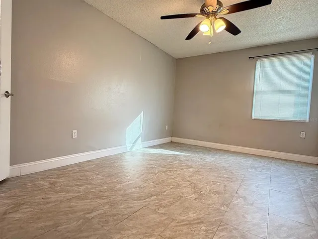 a view of an empty room and window