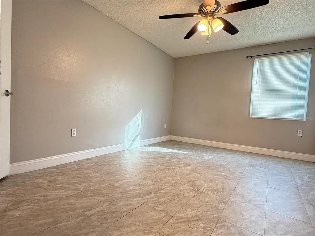 2789 L B McLeod Road, Unit 2789B Orlando, FL 32805 - Photo 8 of 8 a view of an empty room and window