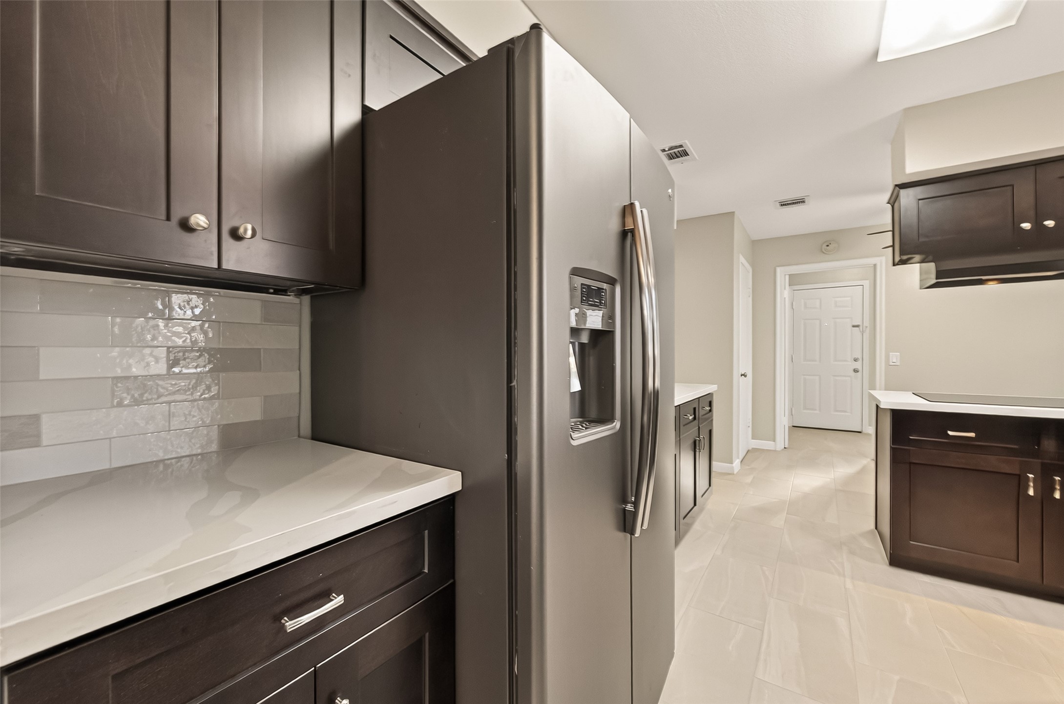 5211 Hummingbird Street Houston, TX 77035 - Photo 20 of 48 a kitchen with stainless steel appliances a refrigerator and a stove top oven