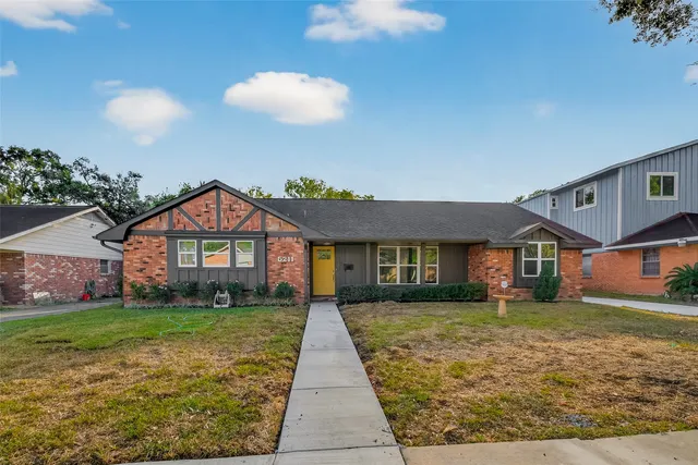 a front view of a house with yard