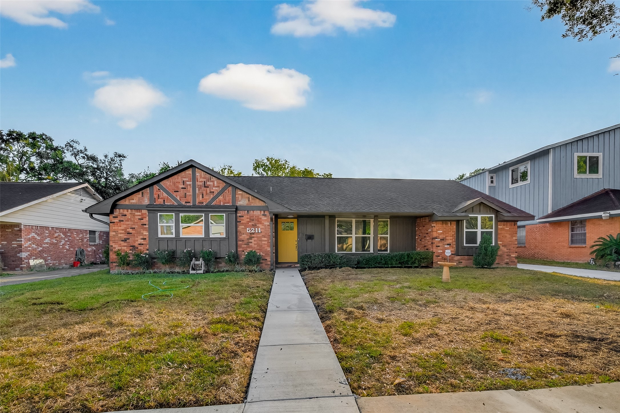 5211 Hummingbird Street Houston, TX 77035 - Photo 2 of 48 a front view of a house with yard