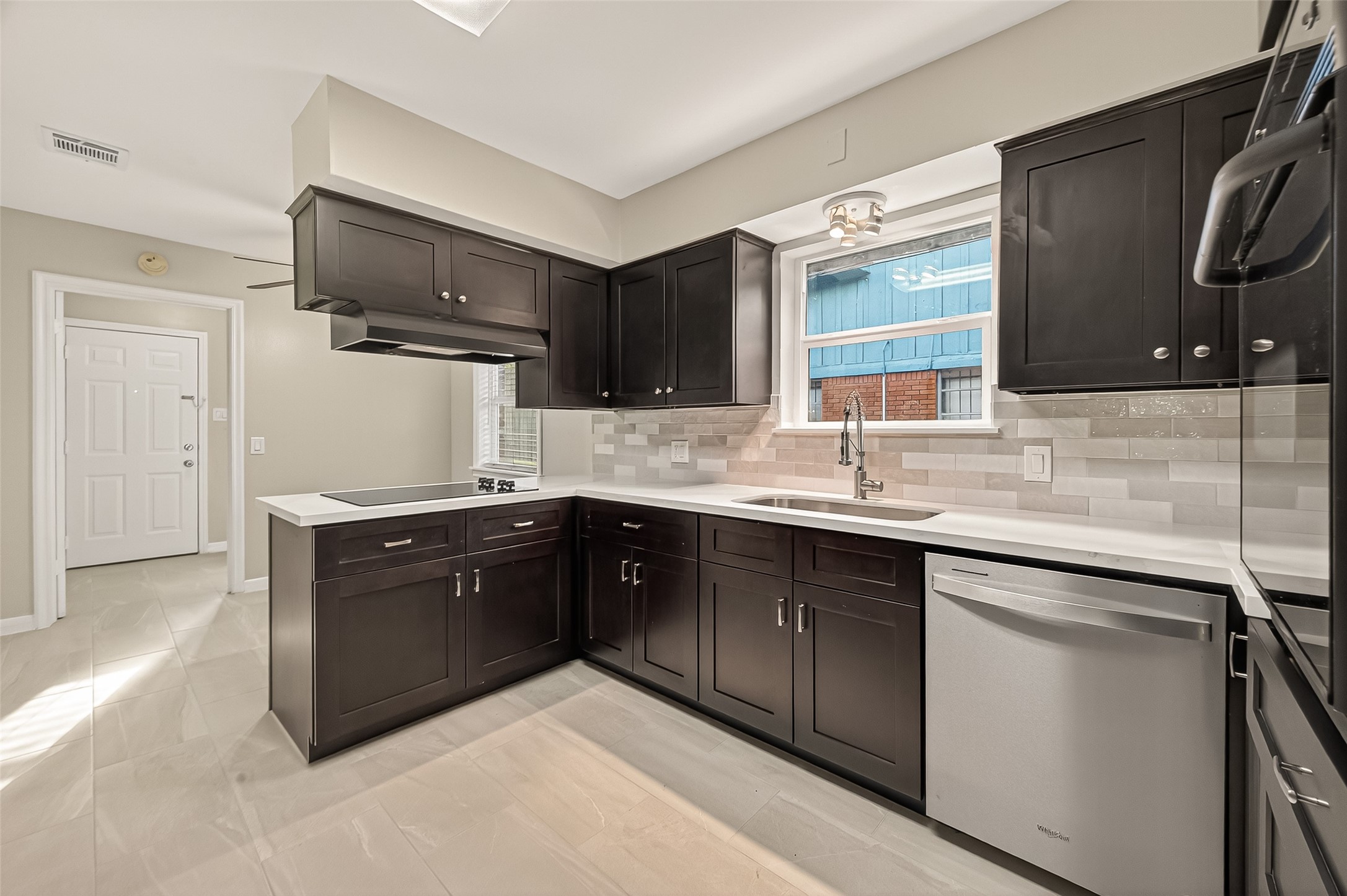 5211 Hummingbird Street Houston, TX 77035 - Photo 21 of 48 a kitchen with a sink cabinets and appliances