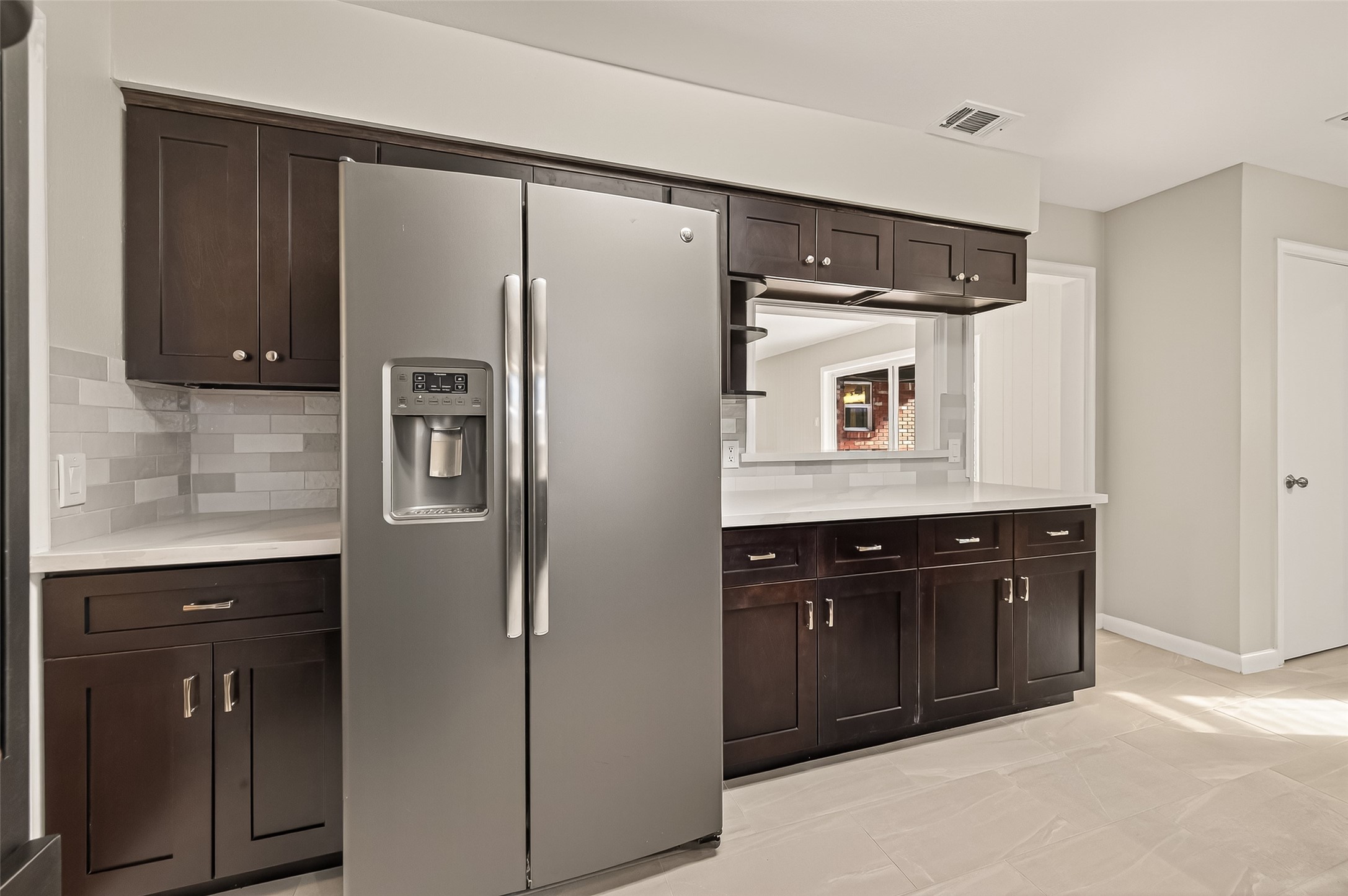 5211 Hummingbird Street Houston, TX 77035 - Photo 22 of 48 a kitchen with a refrigerator and a sink
