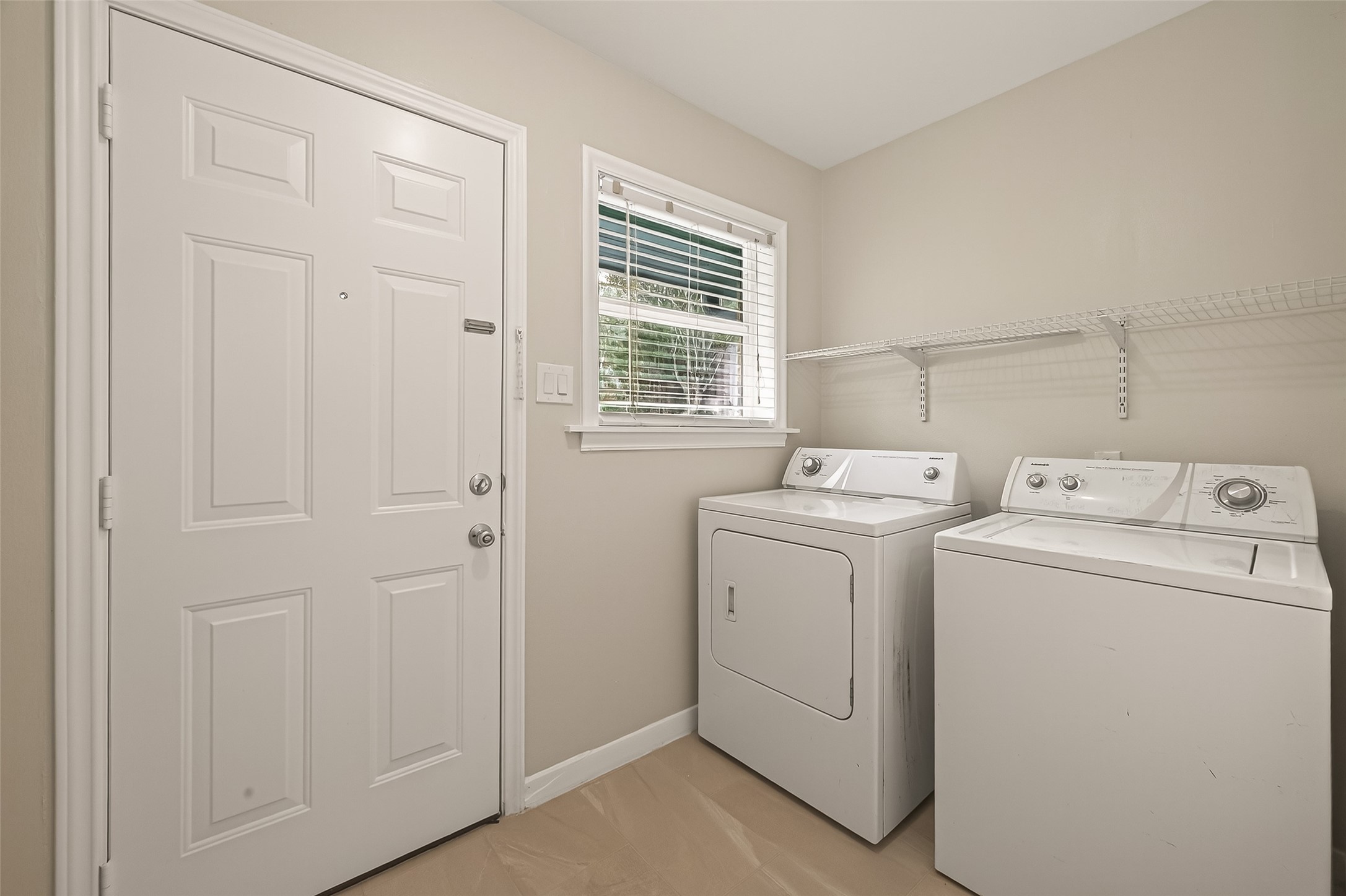 5211 Hummingbird Street Houston, TX 77035 - Photo 26 of 48 a utility room with dryer and washer