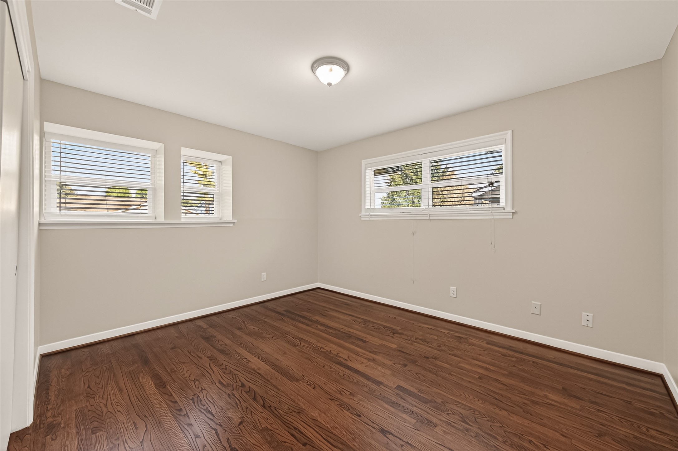 5211 Hummingbird Street Houston, TX 77035 - Photo 28 of 48 a view of empty room with wooden floor and fan