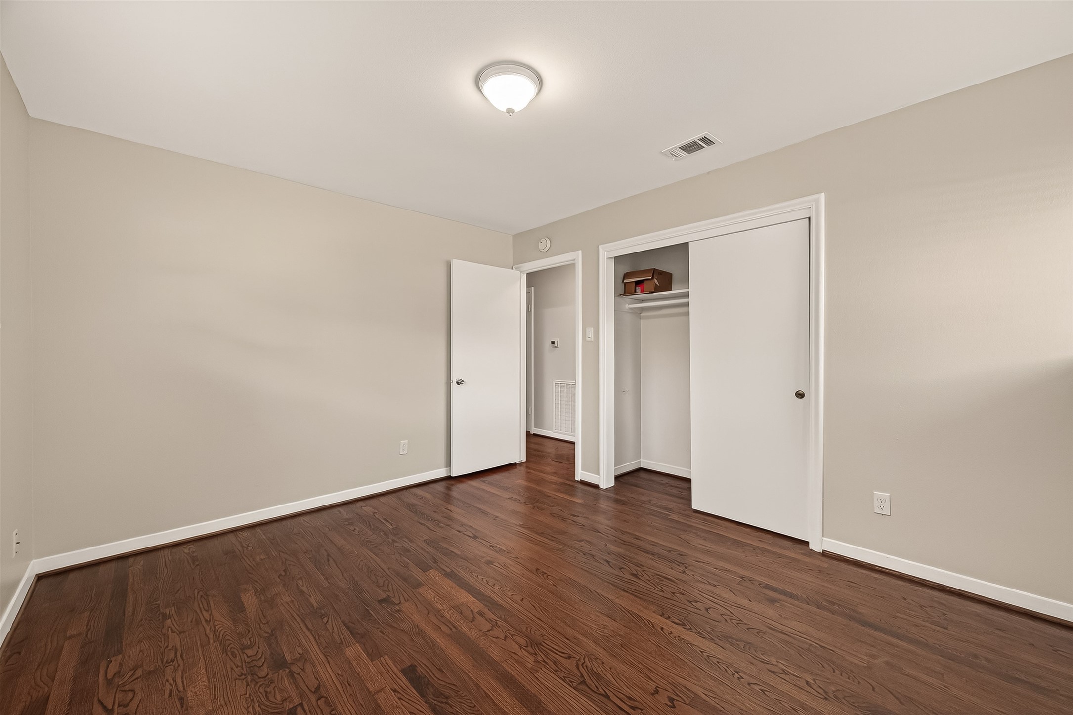5211 Hummingbird Street Houston, TX 77035 - Photo 30 of 48 a view of an empty room with wooden floor