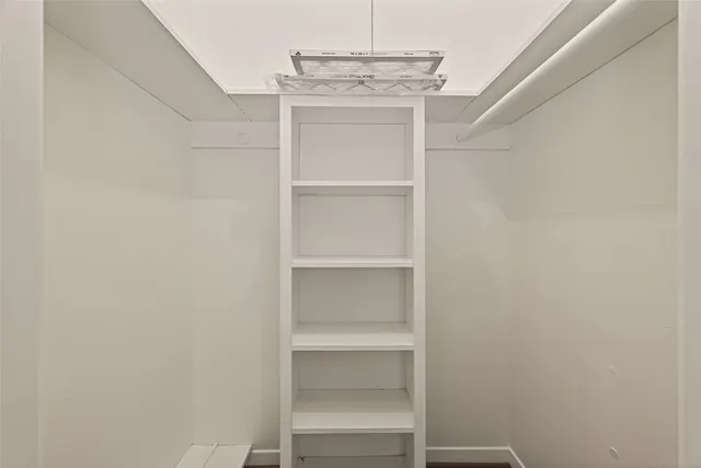 a view of an empty walk in closet