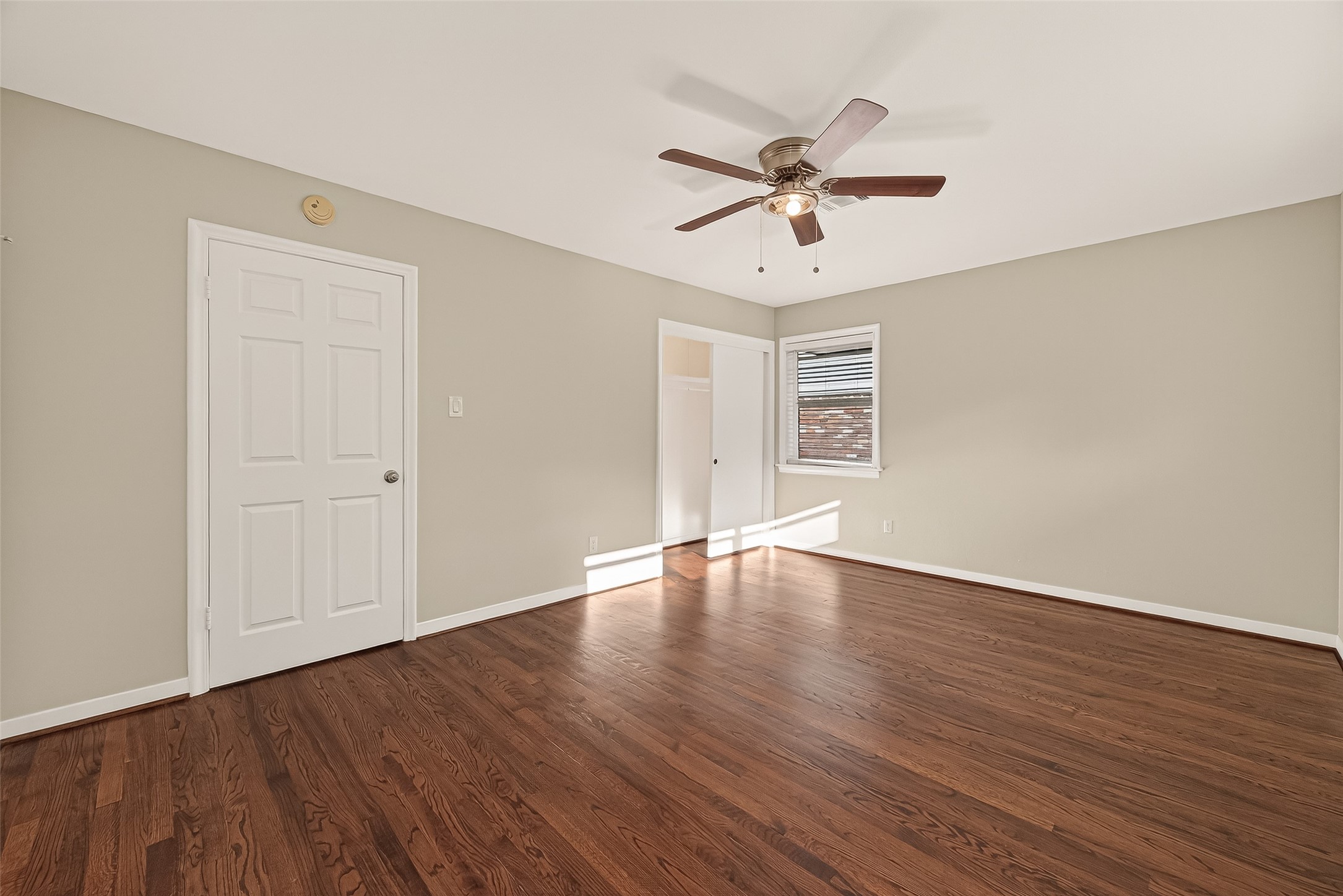 5211 Hummingbird Street Houston, TX 77035 - Photo 36 of 48 a view of empty room with wooden floor and fan