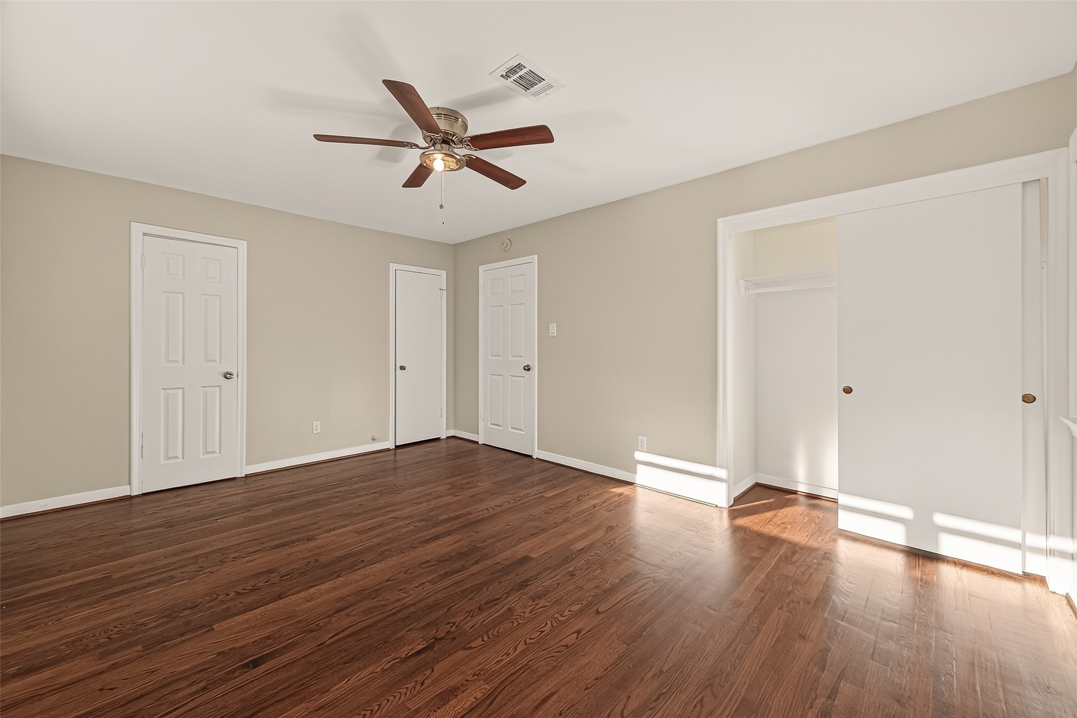 5211 Hummingbird Street Houston, TX 77035 - Photo 37 of 48 a view of empty room with wooden floor