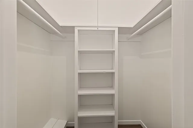 a view of an empty walk in closet