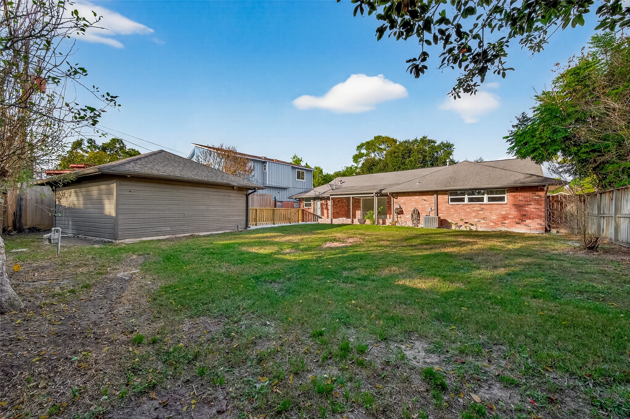 5211 Hummingbird Street Houston, TX 77035 - Photo 46 of 48 a front view of a house with a garden