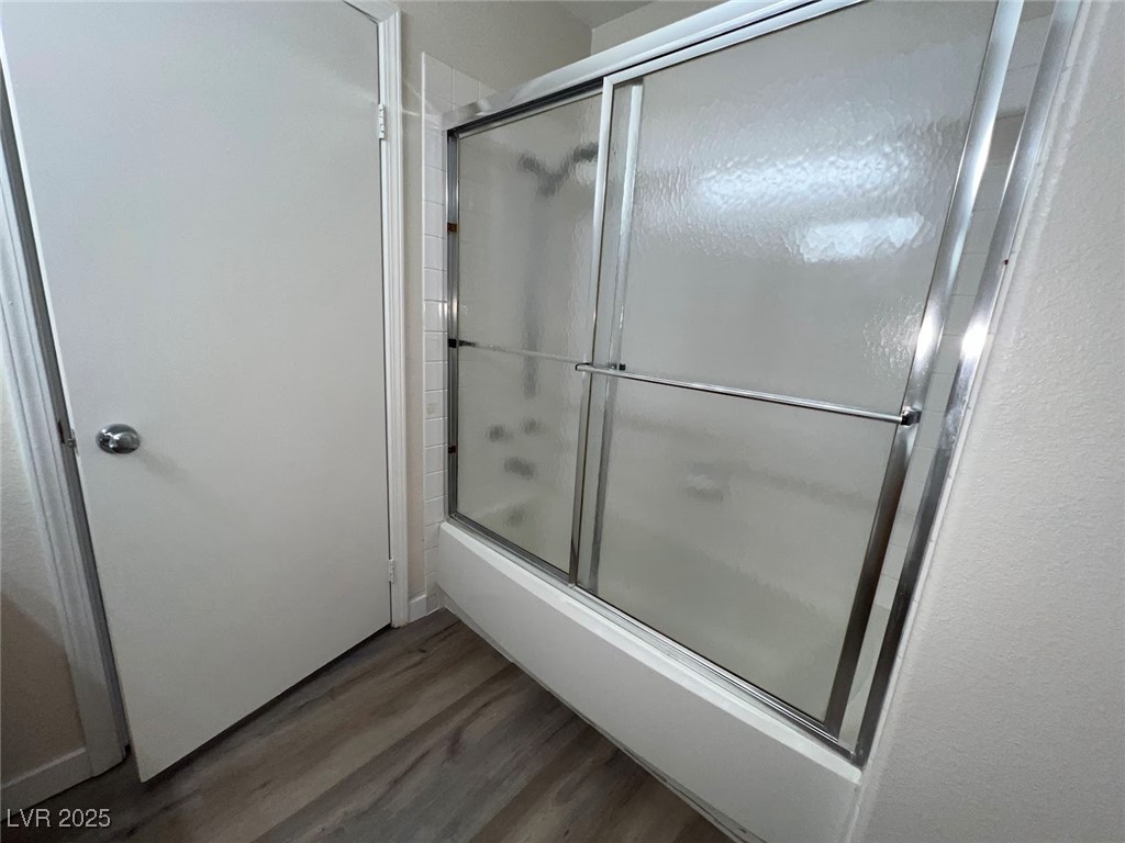 635 Delorean Drive North Las Vegas, NV 89081 - Photo 11 of 22 Bathroom with shower / bath combination with glass door and dark wood-type flooring