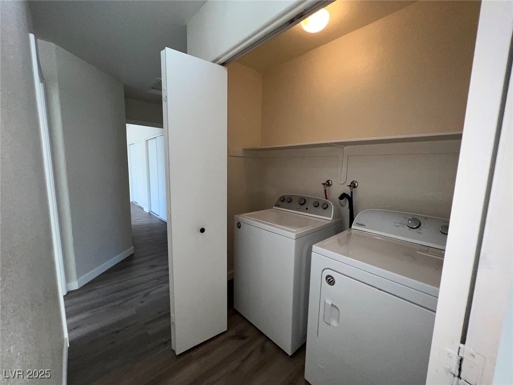 635 Delorean Drive North Las Vegas, NV 89081 - Photo 17 of 22 Laundry room with dark wood-style floors and separate washer and dryer