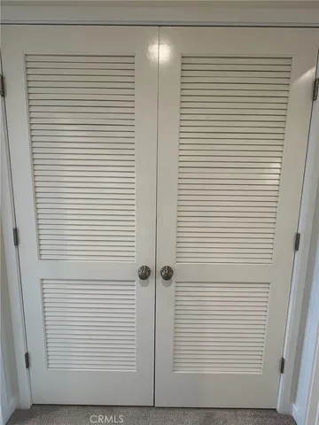 a view of a door and a window