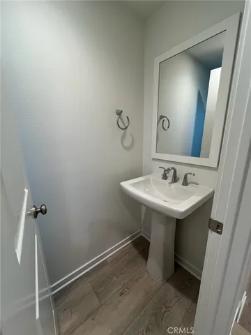 a bathroom with a sink and mirror