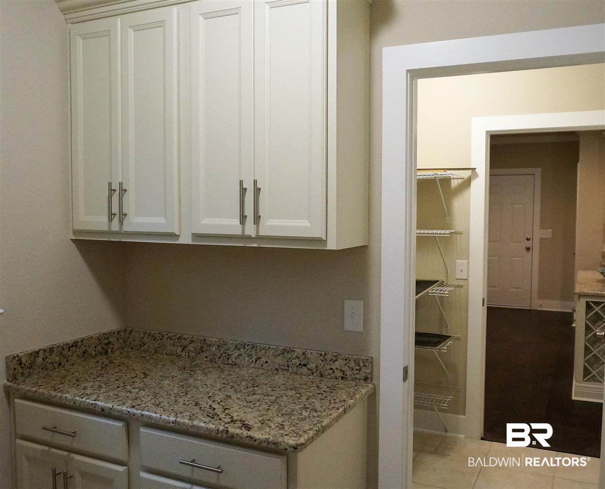 18413 Treasure Oaks Road Gulf Shores, AL 36542 - Photo 16 of 31 Laundry room cabinets
